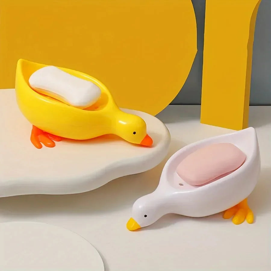 Duck-shaped self-draining soap tray.