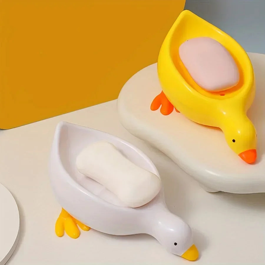 Duck-shaped self-draining soap tray.