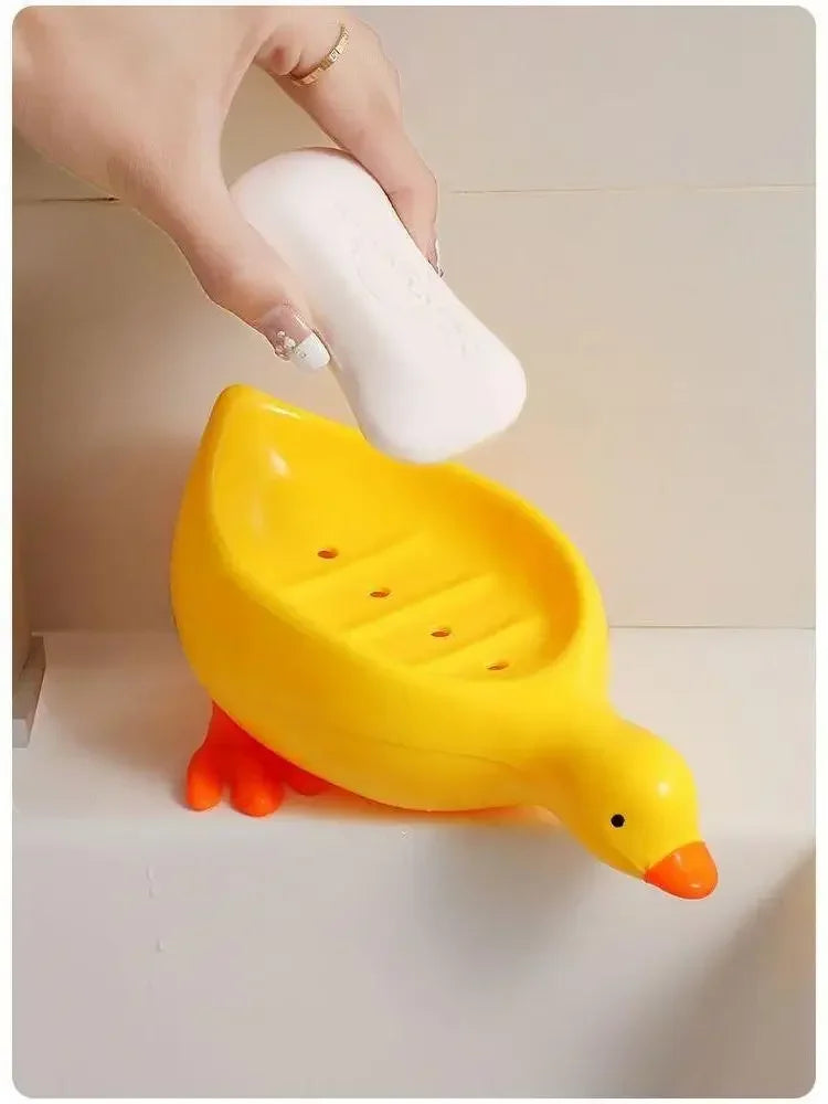 Duck-shaped self-draining soap tray.