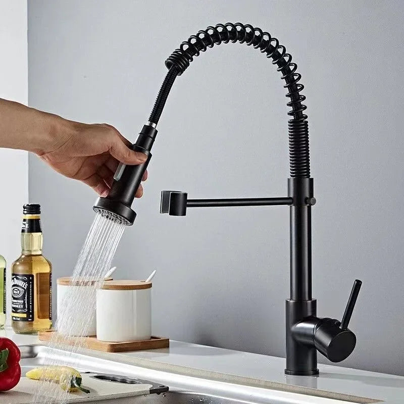 Touchless gold kitchen faucet with pull-out sprayer.