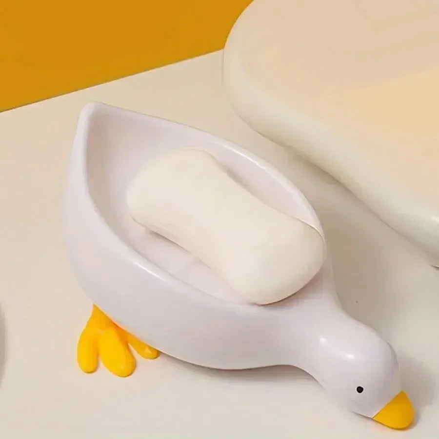 Duck-shaped self-draining soap tray.