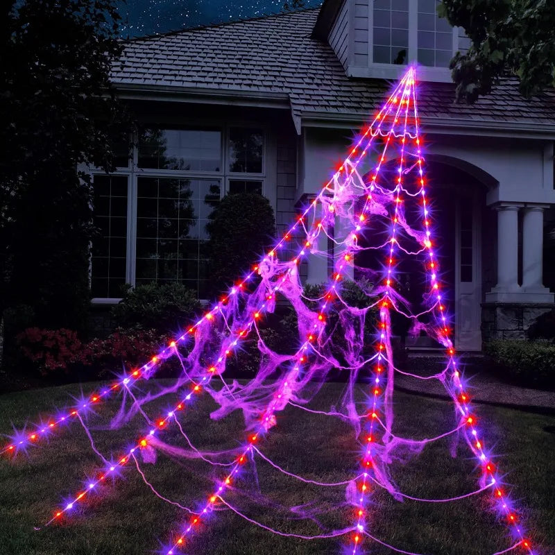 Glow-in-the-dark spider web Halloween yard decor.