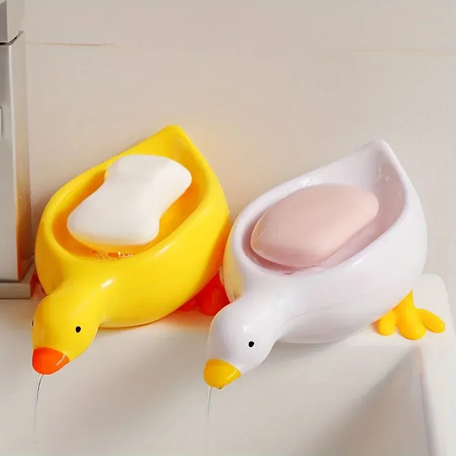 Duck-shaped self-draining soap tray.