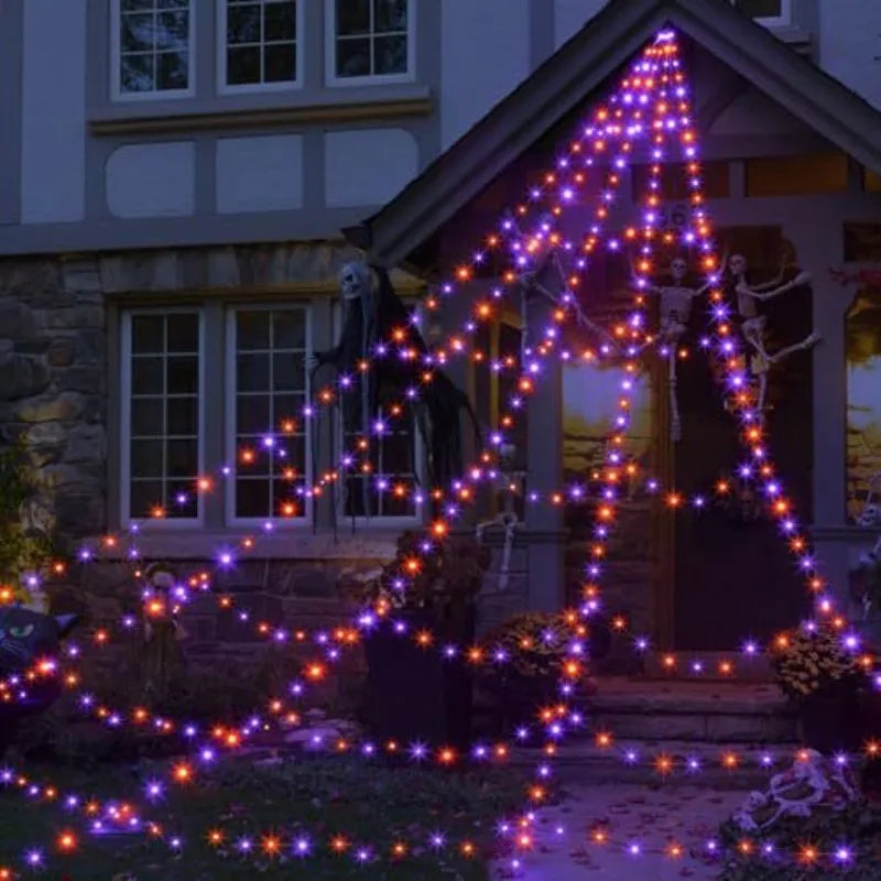 Glow-in-the-dark spider web Halloween yard decor.