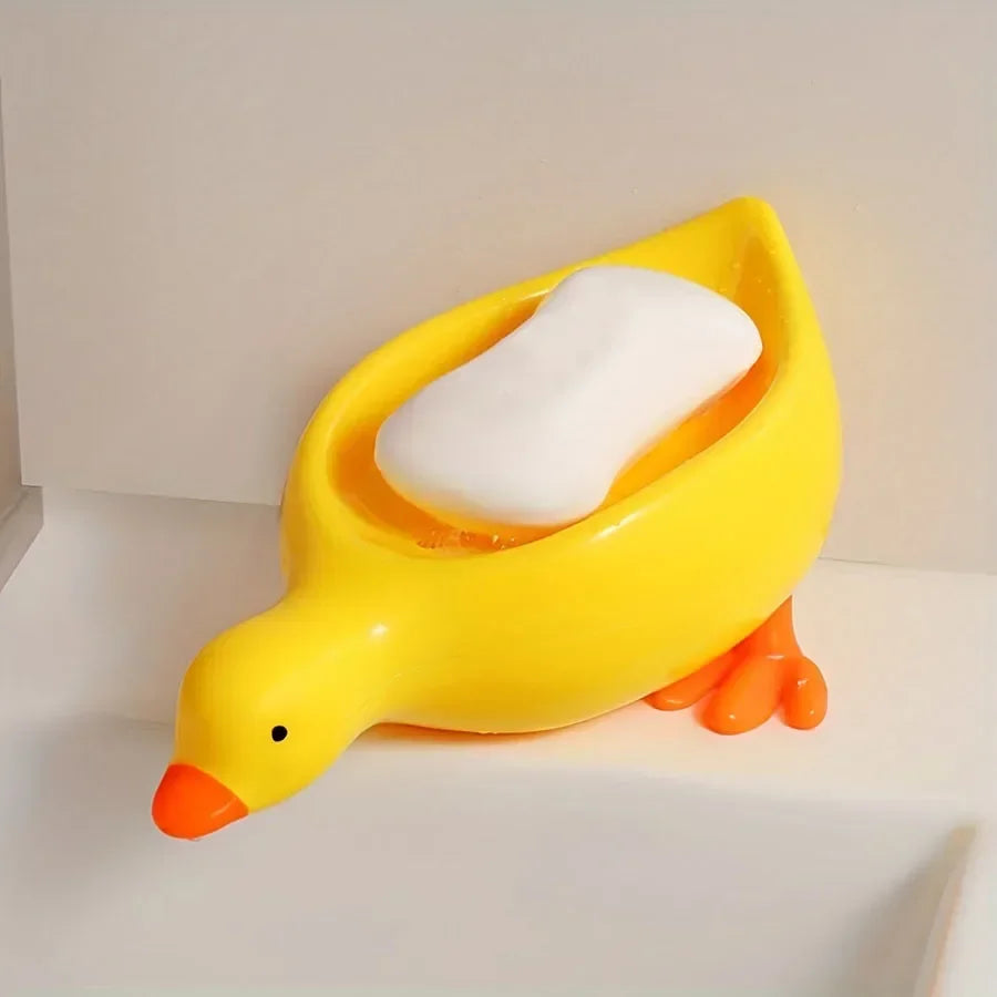Duck-shaped self-draining soap tray.